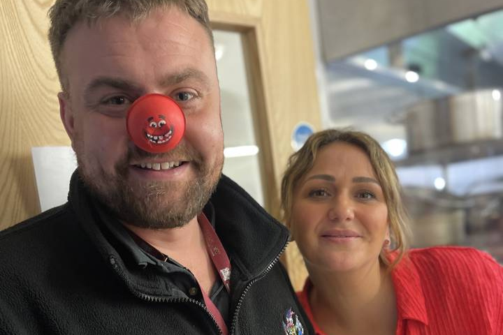 male health care worker and female health care worker celebrating Red Nose Day