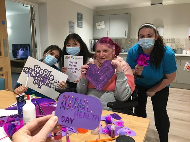 Resident and colleagues with crafts for World Mental Health Day 2020 