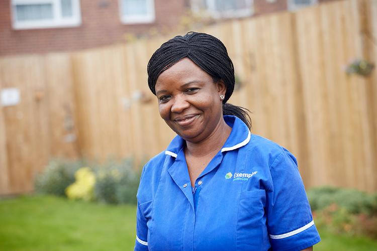 Nurse stood in care home garden