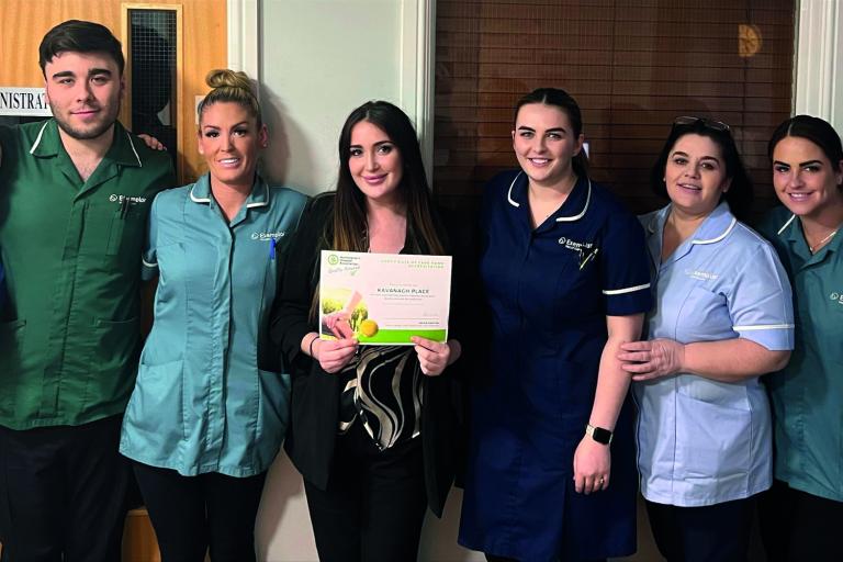 Kavanagh Place team stood with HDA certificate