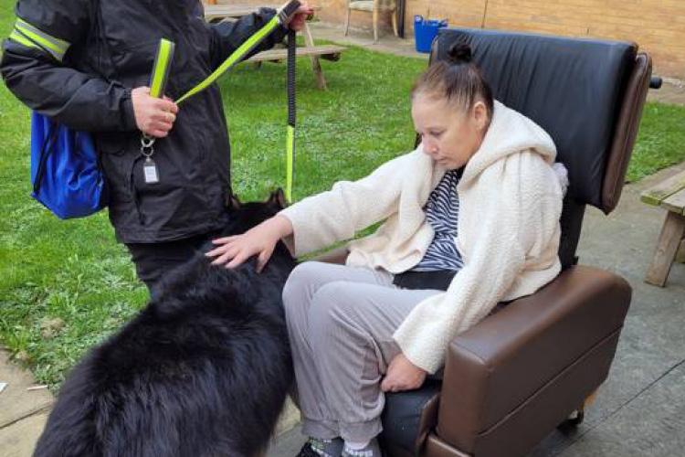 Female service user with dog for animal therapy