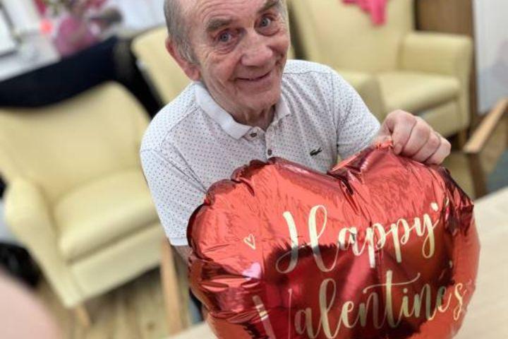 Male service user with balloon