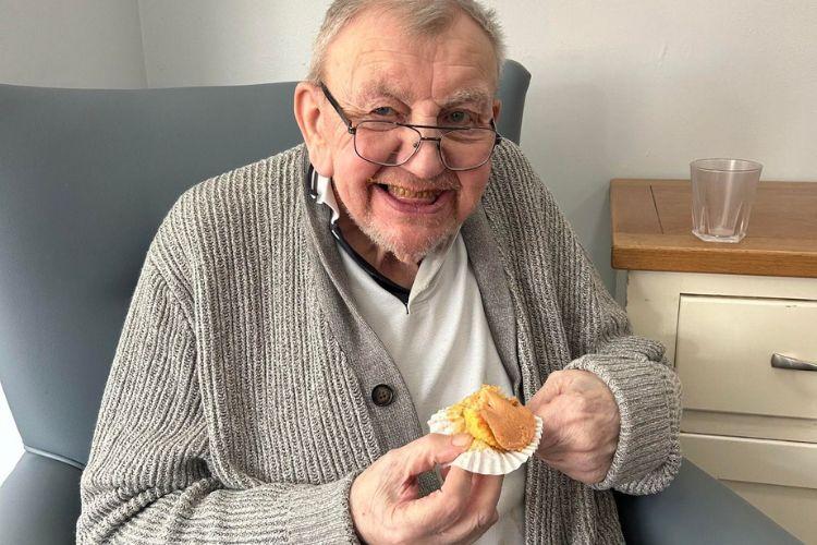 Male service user with cupcake